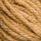 Close-up image of Caledonian Dye Works Halcyon Yarn Classic Rug Wool | Skein in beige. The hand-dyed yarn appears thick, with visible individual threads and fiber texture. The strands are loosely twisted together, showcasing a soft and fuzzy surface that weavers will appreciate. The image focuses on the texture and details of the yarn.
