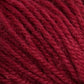 Close-up image of Halcyon Deco Rug Wool in red from Caledonian Dye Works. The fibers are tightly twisted, creating a textured appearance. This 100% wool yarn appears soft and plush, perfect for knitting or crocheting various items. The deep red color is rich and consistent throughout the strands, making it a versatile yarn choice.