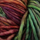 Close-up of skeins of Malabrigo Mecha yarn by Malabrigo Yarn in rich, multicolored hues, including shades of red, purple, green, and brown, intricately twisted together. The textures appear soft and woolly—ideal for knitting or crocheting with superwash bulky yarn.