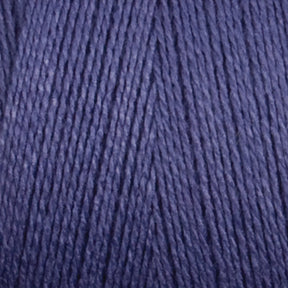 Close-up of a ball of Maurice Brassard 8/2 Bamboo Yarn in dark blue. The texture of the yarn is visible, showcasing the fine, tightly wound strands. The color is consistent, with a slight sheen reflecting the light. This environmentally friendly yarn offers antibacterial properties for your crafting needs.