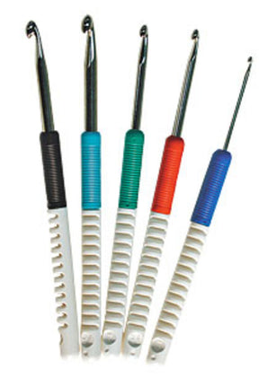 A set of five Skacel Soft-Handle Comfort Grip Crochet Hooks with color-coded handles, arranged vertically in a fan shape. Each hook has a white plastic handle with a different colored grip: black, green, teal, red, and blue. The metallic hooks vary slightly in size to accommodate all your crafting needs from the renowned brand Skacel.