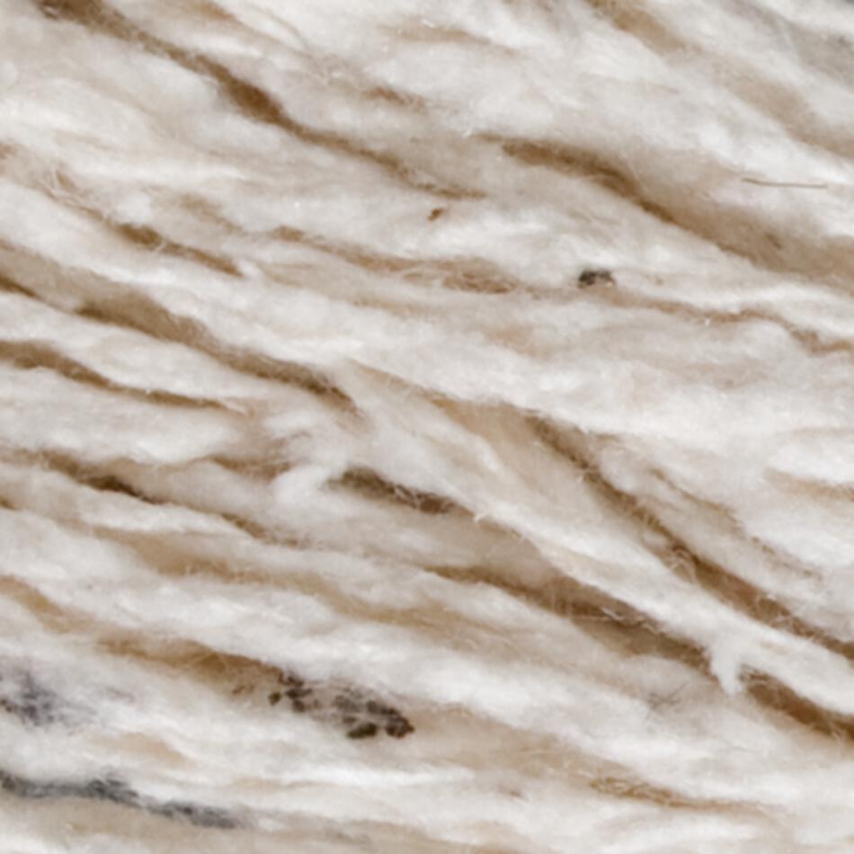 Close-up of a texture that appears to be a soft, woolen fiber blend in shades of white and light brown, with a slightly fuzzy appearance. The interwoven fibers evoke the luxurious feel of Henry's Attic 2-Ply Silk Noil Yarn (Raw Silk) | Large Cone, creating a warm and inviting sensation.