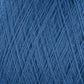 Close-up image of blue, medium grade wool yarn from the Jagger Brothers, Inc.'s JaggerSpun Maine Line 2/20 Yarn on a large cone, displaying a crisscross pattern of fine threads. The texture is soft and fibrous, with intricate layers interweaving. The image emphasizes the detailed structure and color of the JaggerSpun yarns.