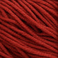 Close-up of a bundle of thick, red Plymouth Select Worsted Merino Superwash from Plymouth Yarn Co., showcasing its rich texture and tightly woven strands. The yarn appears soft and slightly fuzzy, with excellent stitch definition, ready for knitting or crocheting.