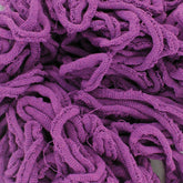 A close-up image of a tangled pile of purple Harrisville Potholder Loops - Traditional Size Mini Pack. Made from cotton loops by Friendly Loom, the fabric has a soft and textured appearance, with loops and twists creating a visually intricate pattern reminiscent of designs made on a traditional loom.