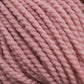 Close-up image of a ball of thick, twisted Norumbega yarn in a soft pastel pink color, showcasing its texture and fibers in detail. Ideal for weavers, this 100% U.S. wool yarn from Caledonian Dye Works promises both quality and beauty for your craft projects.