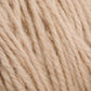 Close-up image of Halcyon Deco Rug Wool from Caledonian Dye Works, showcasing detailed textures and fibers of the thick, twisted strands. The 100% wool yarn appears plush and cozy, making it ideal for knitting or crocheting projects. This versatile yarn is perfect for creating garments or even a charming decorative rug.