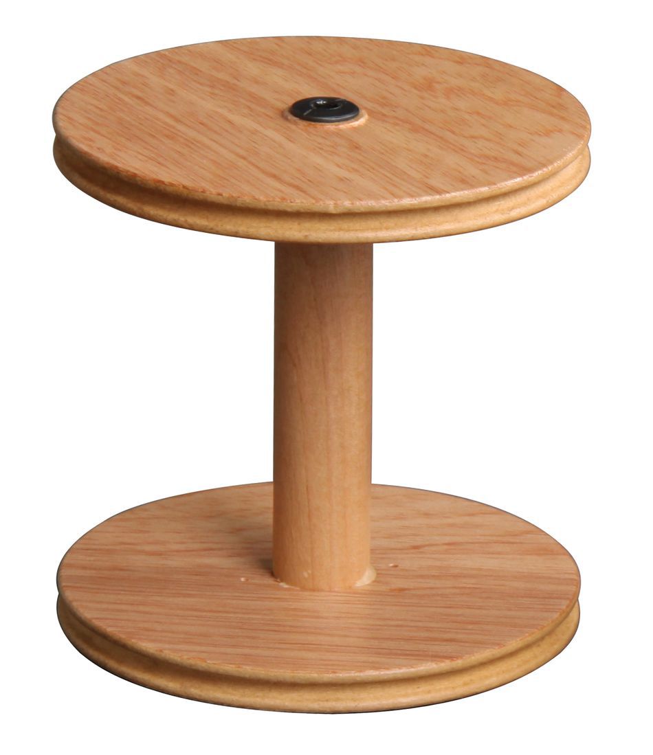 Against a plain white background stands the Ashford Jumbo Bobbin by Ashford Handicrafts Limited, upright in its natural wood grain splendor. It features two circular discs connected by a central cylindrical column, with a small black dot positioned at the center of the top disc.