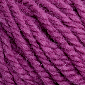 Close-up view of pinkish-purple Halcyon Yarn Classic Rug Wool | Strand by Caledonian Dye Works, featuring tightly twisted strands and a slightly fuzzy texture, perfect for rug weavers and hand-dye projects.