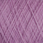 Close-up view of a tightly wound ball of lilac-colored JaggerSpun Maine Line 3/8 Yarn | Large Cone from Jagger Brothers, Inc. The yarn is arranged in a crisscross pattern, showcasing its soft and fuzzy texture. The image highlights the fine threads and the uniformity of the winding, typical of this soft medium-grade wool.