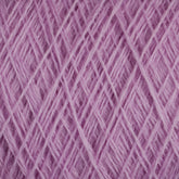 Close-up view of a tightly wound ball of lilac-colored JaggerSpun Maine Line 3/8 Yarn | Large Cone from Jagger Brothers, Inc. The yarn is arranged in a crisscross pattern, showcasing its soft and fuzzy texture. The image highlights the fine threads and the uniformity of the winding, typical of this soft medium-grade wool.