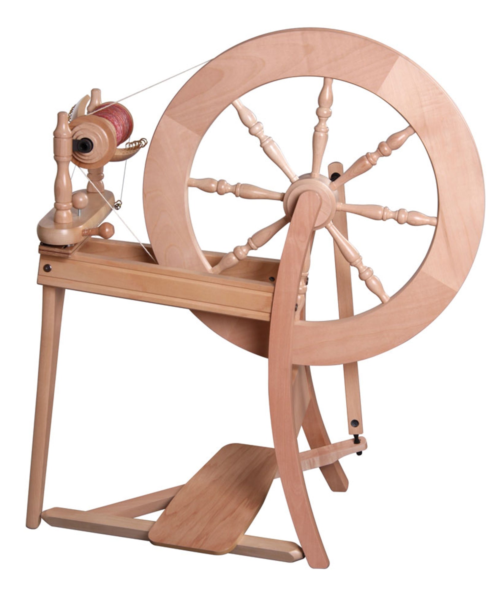 The Ashford Traditional Spinning Wheel by Ashford Handicrafts Limited features a large wheel connected to a smaller bobbin, a flyer, and a treadle. Resting on a tripod stand, this device is perfect for spinning fibers into yarn or thread. Its natural wood finish accentuates the classic design and exceptional craftsmanship.