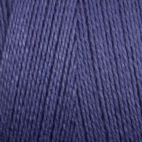 Close-up image of Maurice Brassard's 8/2 Bamboo Yarn | Mini-cone in blue, showcasing the texture and tightly wound strands. The color is a rich, medium-toned blue, and the fibers appear soft and consistent, ideal for knitters who value environmentally friendly materials in their knitting or crocheting projects.