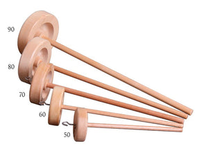 Five Ashford Top Whorl Spindles by Ashford Handicrafts Limited, each varying in size and labeled by weight from 90 to 50 grams, are arranged in a row from largest to smallest. These wooden spindles feature smooth, circular whorls and long shafts with hooks.