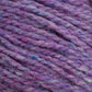 Close-up image of purple yarn intertwined with shades of lavender, blue, and pink fibers. The texture appears soft and slightly fuzzy, indicative of a warm, woolen material suitable for knitting or crocheting, showcasing the natural charm of unscoured Harrisville Designs' Harrisville Highland - Cones.