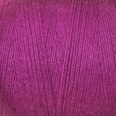 Close-up view of a spool of magenta-colored Maurice Brassard 8/2 Cottolin Organic Yarn | Tube, highlighting the texture and tightness of the individual threads. This soft and slightly fuzzy yarn is perfect for knitting or crocheting projects, complementing any cotton linen blend and ideal for use in a Cottolin Tea Towel Kit.