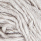 Close-up image of Jöklalopi (Bulky Lopi) by Berroco, Inc., showcasing off-white woolen yarn with thick, twisted fibers. The texture appears soft and slightly fluffy. The yarn is coiled loosely, with individual strands visibly intertwined, exuding a rustic handmade charm perfect for chunky winter sweaters.