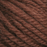 Close-up of Halcyon Yarn Classic Rug Wool | Skein displaying its thick, twisted fibers. The texture appears soft and slightly fuzzy, ideal for knitting or crocheting. Perfect for weavers, this hand-dyed rug wool by Caledonian Dye Works adds a rich, earthy tone to any project.