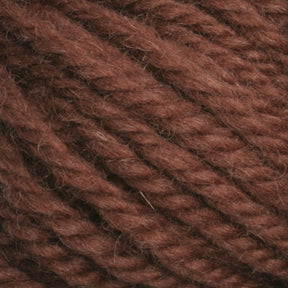 Close-up of Halcyon Yarn Classic Rug Wool | Skein displaying its thick, twisted fibers. The texture appears soft and slightly fuzzy, ideal for knitting or crocheting. Perfect for weavers, this hand-dyed rug wool by Caledonian Dye Works adds a rich, earthy tone to any project.