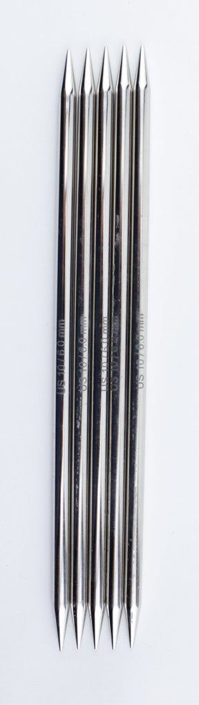 A close-up view of six identical metal multitools arranged side by side. Each multitool, reminiscent of Accessories Unlimited's Nova Platina Double-Point Knitting Needles, has dual pointed ends and cylindrical bodies with a high-quality chrome finish. The plain white background emphasizes the sleek and reflective surface of the tools.