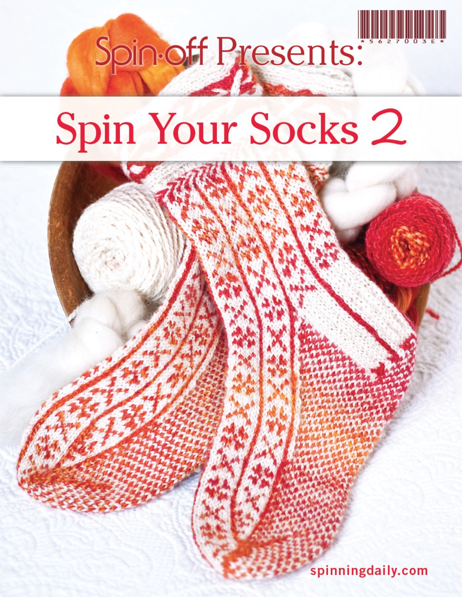 A magazine cover titled "Spin-Off Presents: Spin Your Socks 2: eBook Printed Copy" by Long Thread Media features a close-up of intricately knitted socks in red and orange patterns. The socks are placed in a basket filled with yarn and wool, with the URL spinningdaily.com at the bottom right corner.