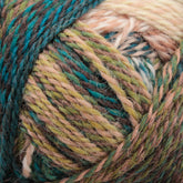 Close-up of a ball of Zauberball Crazy Sock Yarn by Skacel, featuring various shades of green, blue, brown, and beige. The yarn is tightly wound, showcasing a marbled pattern with subtle color changes intertwined. The texture appears soft and slightly fuzzy.