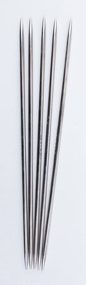 Five straight, double-pointed, high-quality chrome knitting needles are arranged vertically on a plain white background. The Accessories Unlimited Nova Platina Double-Point Knitting Needles are evenly spaced and aligned parallel to each other.