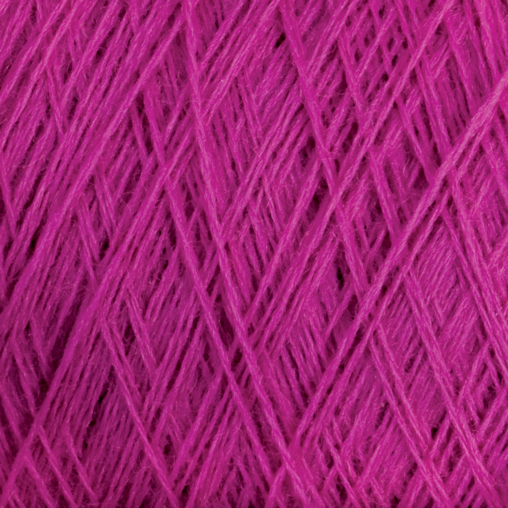 Close-up image of tightly wound JaggerSpun Maine Line 3/8 Yarn | Mini-cone from Jagger Brothers, Inc., in magenta, showcasing intricate, overlapping fibers that create a textured and detailed pattern.