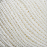 Close-up view of Brown Sheep's Cotton Fleece, showcasing its texture and the individual strands woven together. The yarn appears soft and fluffy, making it perfect for knitting or crocheting intricate patterns.