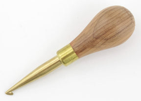 A Ball Handle Hartman Hook from Dorr Fabrics Inc, featuring a handcrafted yew wood handle that is bulbous and tapers seamlessly into a brass shaft with a small Hartman hook at the tip, lies against a white background. Expertly made in Ireland.