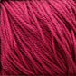 Close-up image of strands of vibrant red Cascade Ultra Pima Cotton Yarn by Cascade Yarns, neatly arranged and showcasing the soft hand of its texture and fibers.