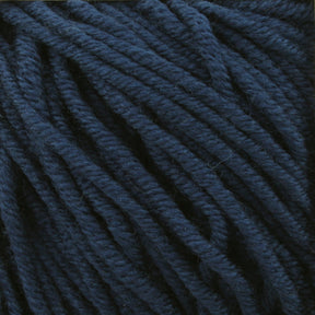 Close-up image of thick, dark blue yarn strands. The Plymouth Select Worsted Merino Superwash yarn by Plymouth Yarn Co. appears soft and tightly spun, with visible texture and slight variations in shading, adding depth to the fibers and enhancing stitch definition.