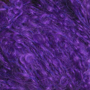 Close-up of vibrant purple, curly fur-like fibers from Caledonian Dye Works' Victorian Bouclé Mohair Yarn, interwoven and layered to create a textured, plush appearance. The densely packed mix of thin and slightly thicker strands gives it a rich and luxurious look akin to Signature Victorian Collection Mohair Bouclé.