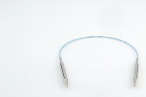 A medical device with a flexible blue tube, featuring some markings, connects two metallic ends. Similar in precision to Skacel's Addi Turbo Circular Knitting Needles, this device is set against a plain white background.