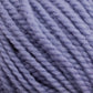 A neatly twisted skein of Norumbega, a chunky blue yarn made entirely from U.S. wool by Caledonian Dye Works, sits against a white background. The Aran weight yarn appears soft and suitable for knitting or crocheting projects.