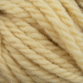 Close-up of several thick, soft, and fluffy strands of pale yellow Halcyon Yarn Classic Rug Wool intertwined together, showcasing the texture and fiber details. Perfect for rug weavers using Caledonian Dye Works' Classic Rug Wool to create hand-dye masterpieces.