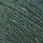 A close-up view of Harrisville Designs' Peace Fleece Yarn in green reveals subtle variations in shade, featuring a slightly fuzzy texture. This worsted weight knitting yarn, blended with wool and mohair, showcases fibers with a mix of lighter and darker green hues, giving it a natural, earthy appearance.