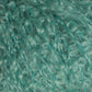 Close-up of turquoise Victorian Bouclé Mohair Yarn from Caledonian Dye Works, showcasing its soft and fluffy texture. The curls are densely packed, creating a tactile and visually intricate pattern that highlights the yarn's thickness and color consistency.