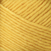 Close-up image of Brown Sheep's Lamb's Pride Worsted Yarn in yellow, wound in multiple layers, showcasing its texture and tightly woven strands. Ideal for felting projects, the yarn appears soft and slightly fuzzy.