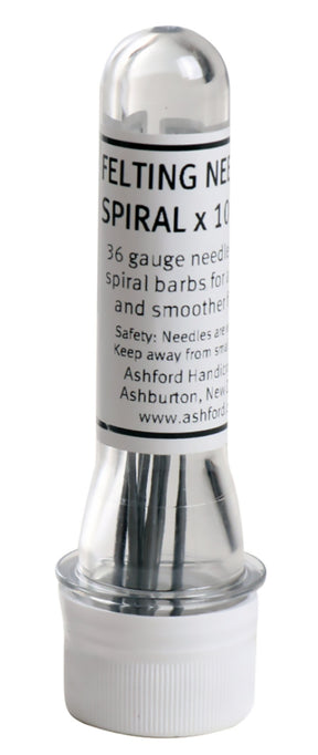 A transparent plastic container labeled "Ashford 36 Gauge Medium Felting Needles" holds multiple spiral felting needles. The label specifies "36 gauge needles with spiral barbs for finer felting and a smoother finish." Safety instructions and the manufacturer's information, Ashford Handicrafts Limited, are also visible.