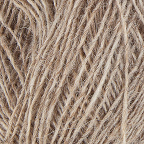 Close-up image of several strands of light brown Einband Lopi yarn intertwined. The fibers have a coarse appearance, with a combination of thicker and thinner threads, creating a natural, rustic look reminiscent of Icelandic wool. The fibers appear to be made from natural materials, characteristic of the quality expected from Berroco, Inc.