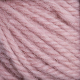 Close-up of soft, pastel pink Halcyon Yarn Classic Rug Wool | Strand by Caledonian Dye Works, showing detailed texture and thick strands twisted together. The yarn appears fluffy and suitable for knitting or crocheting, resembling the quality cherished by rug weavers who enjoy hand-dye techniques.