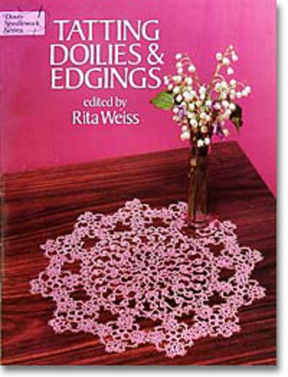 The cover of the Dover Books publication "Tatting Doilies and Edgings" edited by Rita Weiss features an intricate, lacy tatted doily on a wooden table, accompanied by a small vase with white flowers, all set against a pink background.