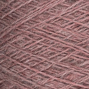 Close-up image of a spool of JaggerSpun Heather 3/8 yarn by Jagger Brothers, Inc., showing tightly wound, thin strands of pinkish-brown fibers. The yarn has a soft, fuzzy texture with slight color variations, creating a rich, warm appearance suitable for knitting or crochet projects.