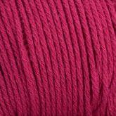 Close-up image of tightly wound Brown Sheep Cotton Fleece yarn. The fibers are neatly aligned and exhibit a soft texture, characteristic of high-quality cotton fleece. The yarn appears to be of medium thickness, perfect for intricate knitting patterns. The color is a rich, deep red.