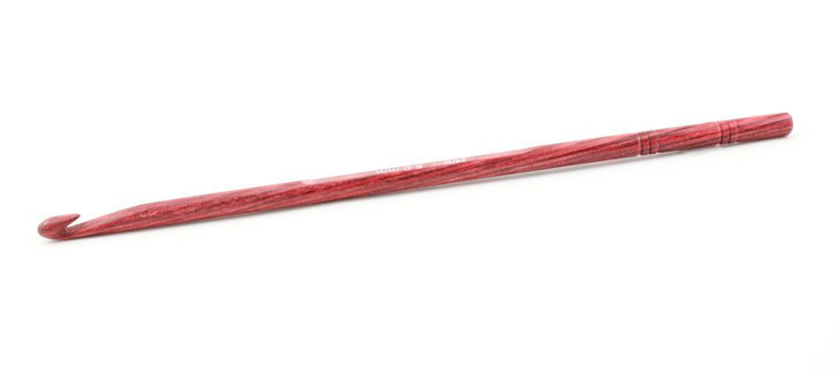 A handcrafted red wooden crochet hook with a smooth finish, the Knitter's Pride Symfonie Dreamz Wooden Crochet Hook from Accessories Unlimited tapers to a curved end for catching yarn, while the opposite end is rounded to highlight the natural wood grain. It sits perfectly against a plain white background.