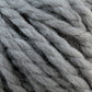 Close-up of thick, twisted grey yarn strands. The Baby Alpaca Grande by Plymouth appears to be ultra-soft and fluffy, with a slightly fibrous texture. Meticulously twisted together, it forms a chunky, durable cord suitable for knitting or crocheting bulky weight projects in mind. This high-quality yarn from Plymouth Yarn Co. exemplifies both luxury and durability.