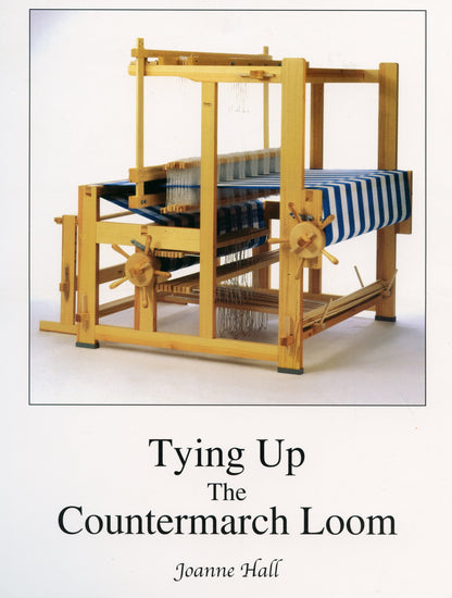 The cover of the Glimakra product, "Tying Up the Countermarch Loom" by Joanne Hall, features a detailed image of a wooden countermarch loom with threads and partially woven fabric in blue and white stripes, set against a plain white background. This visual is perfect for understanding how to position shafts and tie up treadles.