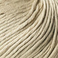 Close-up image of a beige Jo Sharp Soho Summer DK Cotton yarn ball from Kingfisher Yarn & Fibre, displaying the tightly wound strands of fiber. The texture appears soft and smooth, with the strands neatly arranged in parallel lines. The image captures the intricate details of this summer yarn’s composition.