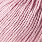 Close-up image of Jo Sharp Soho Summer DK Cotton yarn by Kingfisher Yarn & Fibre. The soft, pale pink cotton showcases tightly coiled strands with visible twists and folds, creating a plush, cozy appearance. This lightweight yarn appears thick and suitable for knitting or crocheting projects.